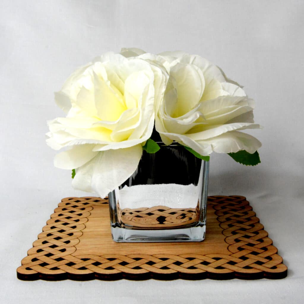 Celtic style Coaster with a flower Laser cut from plywood at Tawny Barn
