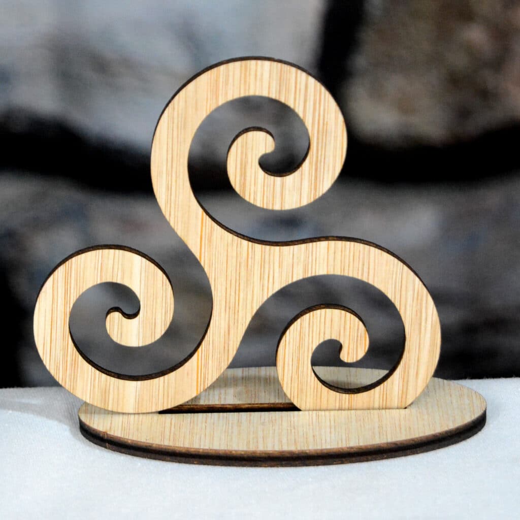 Triskelion wooden Celtic symbol on a table top stand - laser cut at Tawny Barn